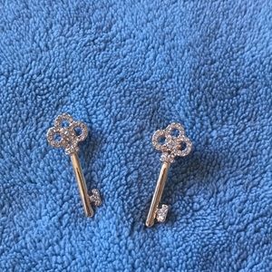 Key pierced earrings.